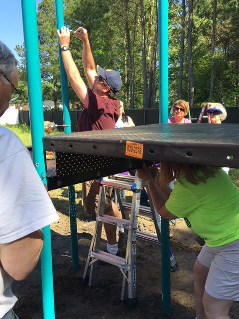 Building the Playground Equipment The crew built the playground equipment.