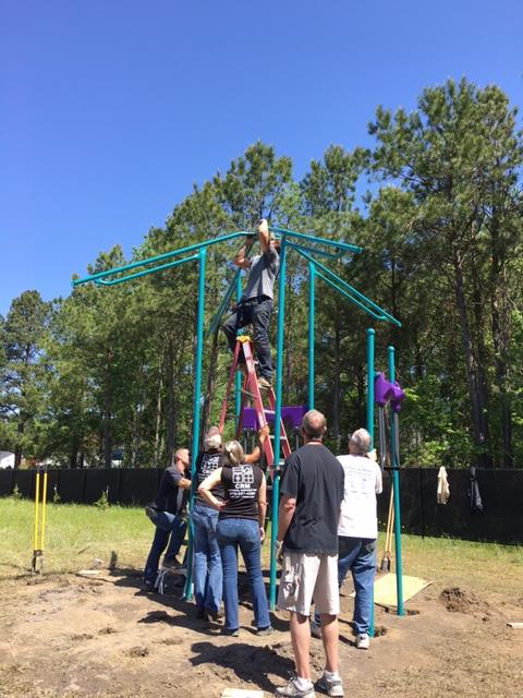 Building the Playground Equipment The crew built the playground equipment.
