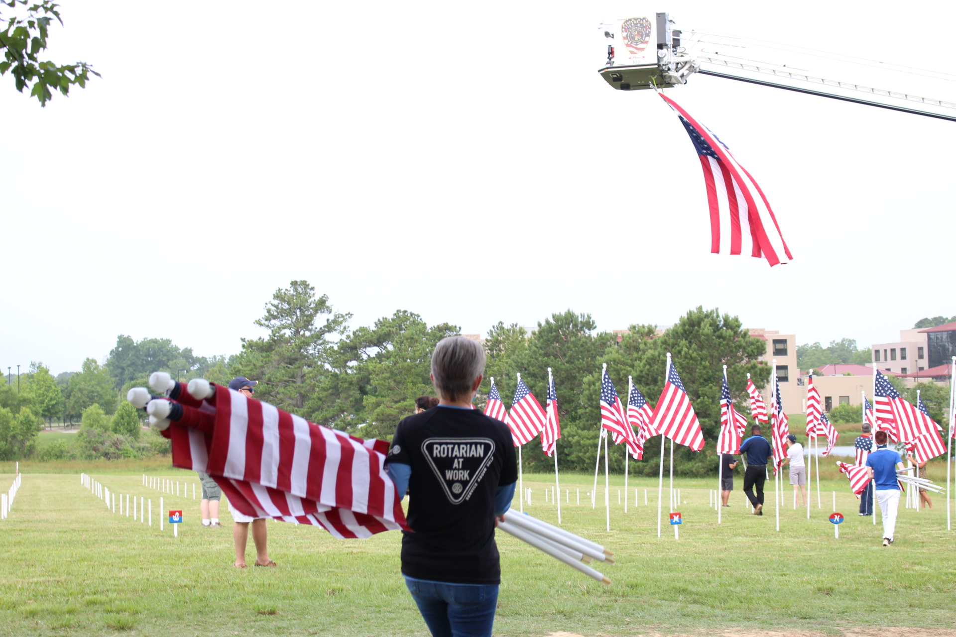 Flags For Heroes 2020 President-Elect Tara Abernathy hauling flags out to be raised in the field. Flags For Heroes 2020
