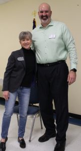 President Tara Abernathy receives a Paul Harris Fellow +1recognition from Rotary Foundation Chair Mike Mullins.
