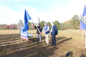 Veteran and family member of the U.S. Air Force talked about their experiences before planting the Marines flag at Veterans Day Tribute, November 12, 2021.